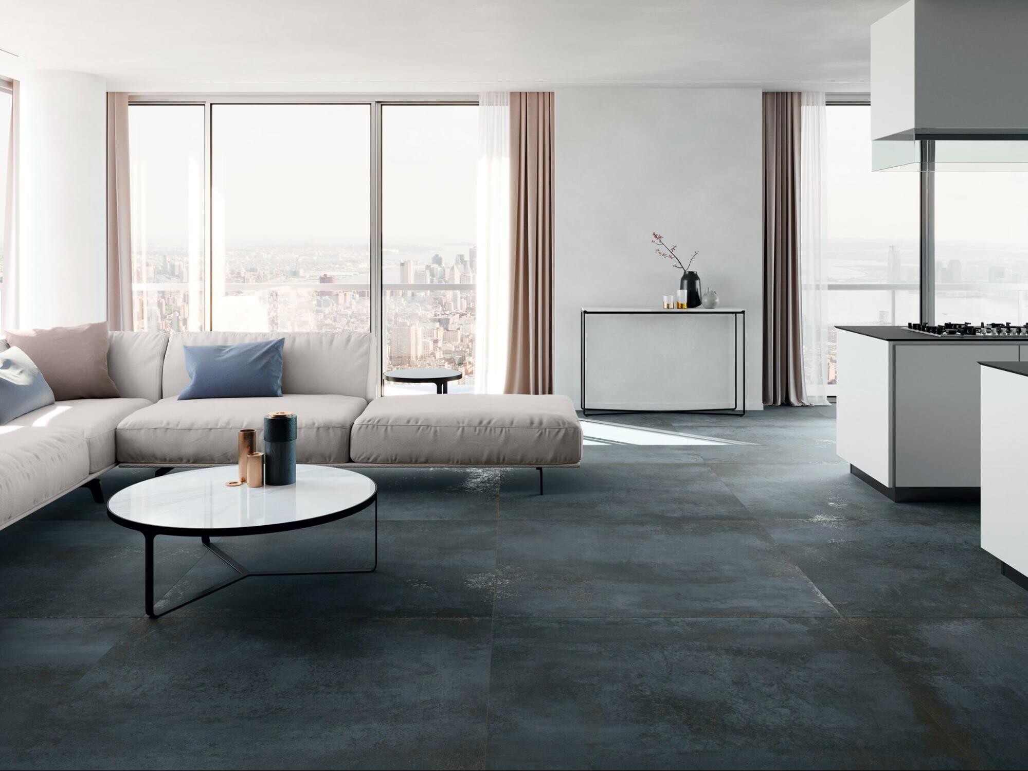 Sal&oacute;n comedor abierto con suelo porcel&aacute;nico en tono oscuro